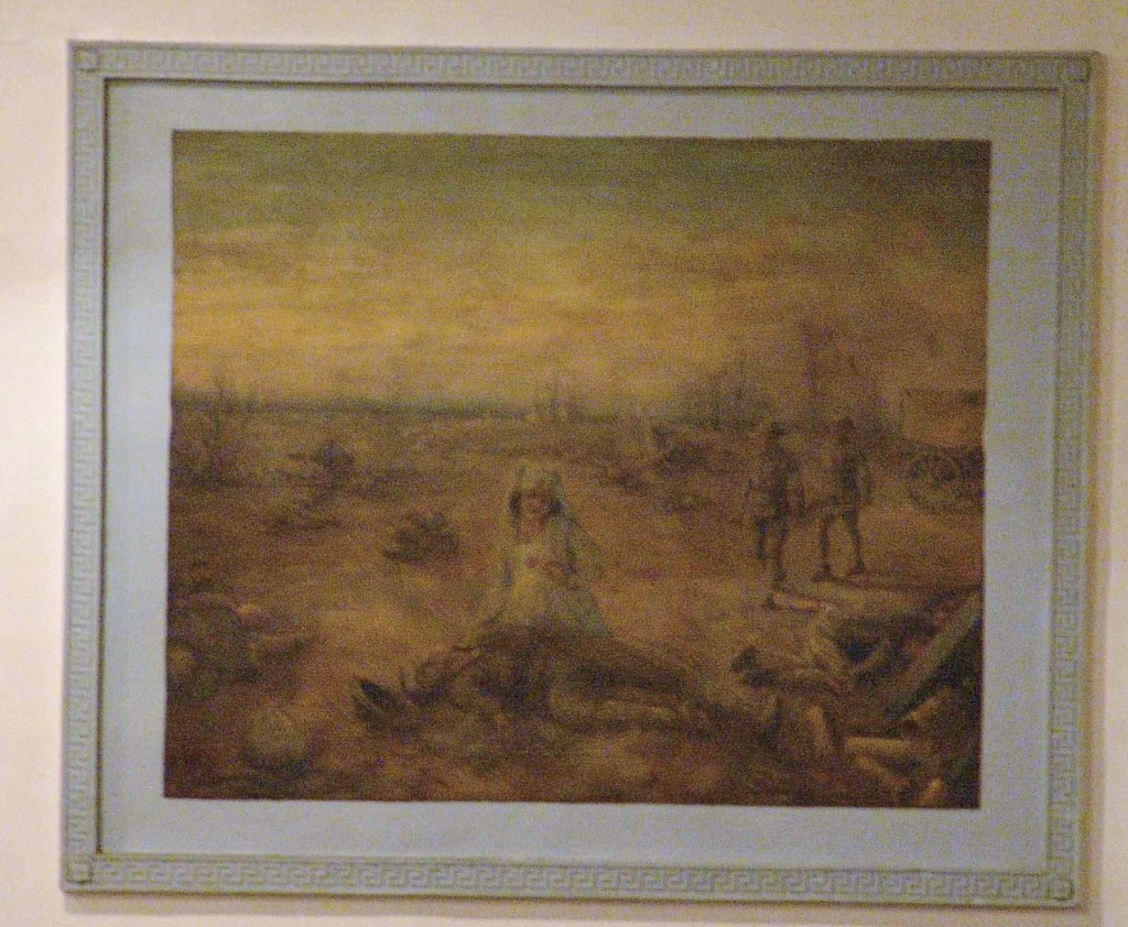 Historic mural of a nurse caring for a wounded soldier on a battlefield